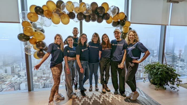 The team under the balloon installation